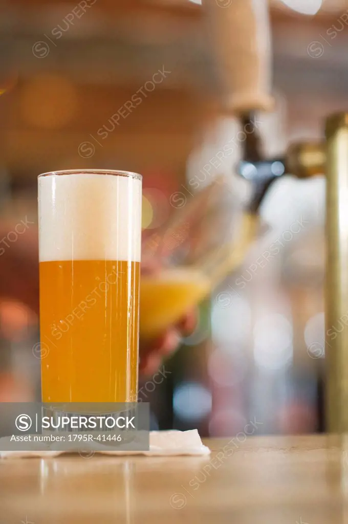 Pint of beer on bar counter