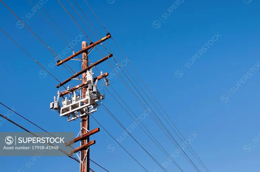 Power line against blue sky