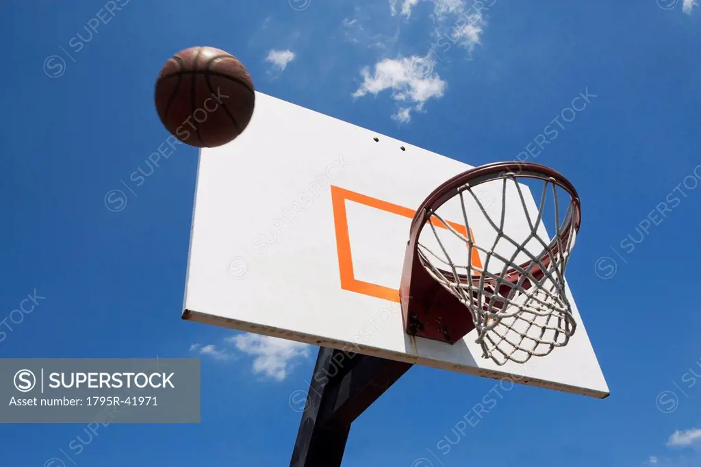 USA, Florida, Miami, Low angle view of basketball flying into hoop