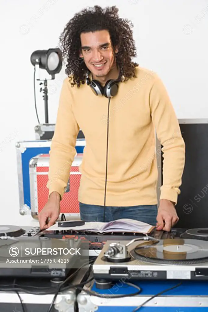 DJ with his music mixing equipment