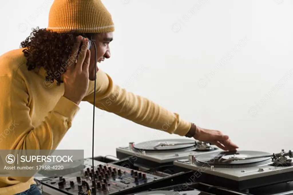 DJ working at music mixing board