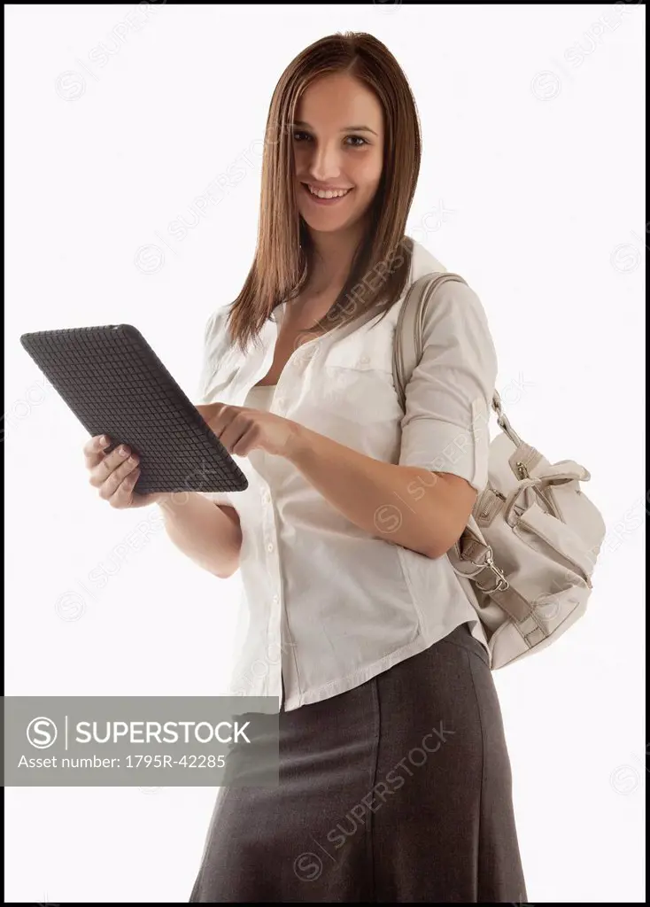 Young attractive businesswoman holding file