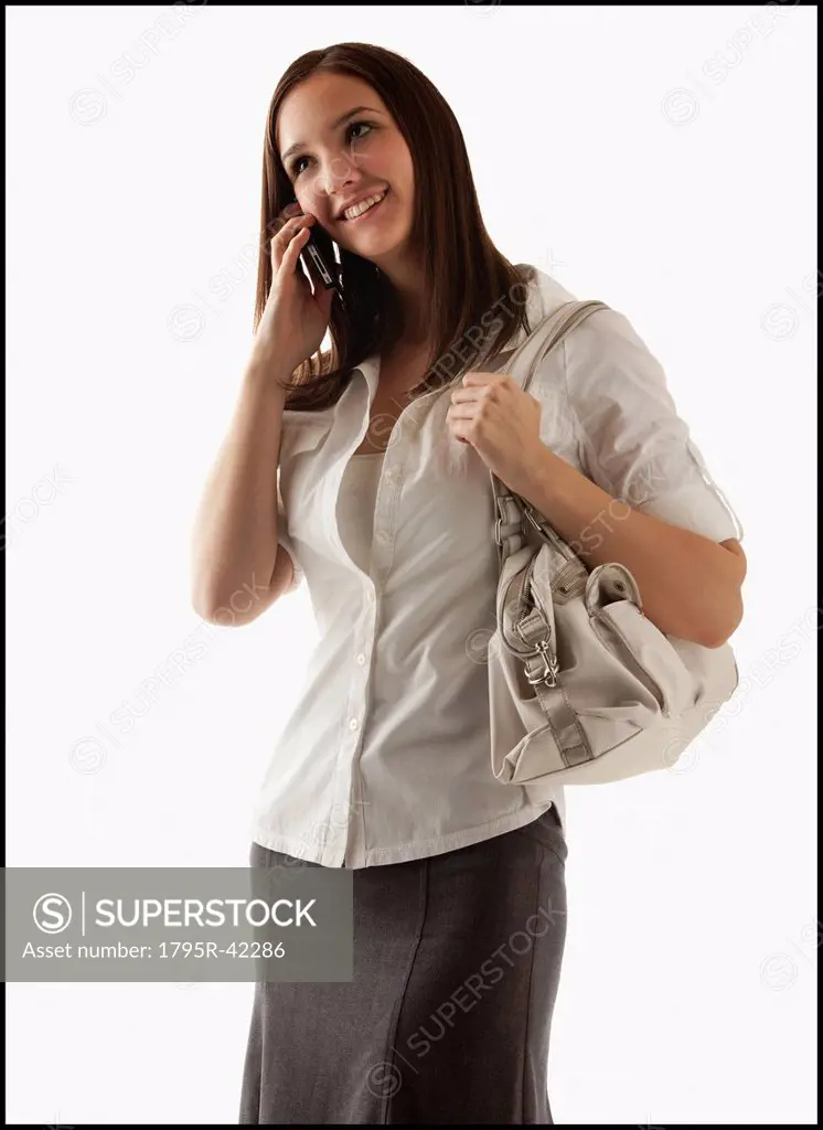 Young attractive businesswoman using mobile phone