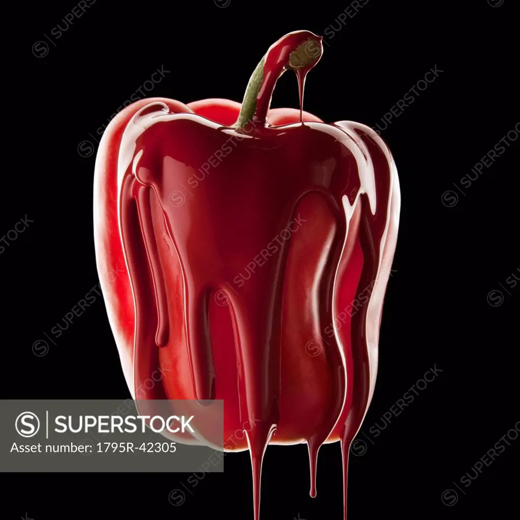 Studio shot of red bell pepper covered with red paint