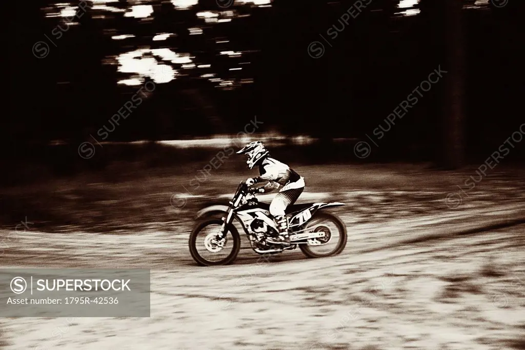 USA, Texas, Austin, Cross motorcyclist on sandy track