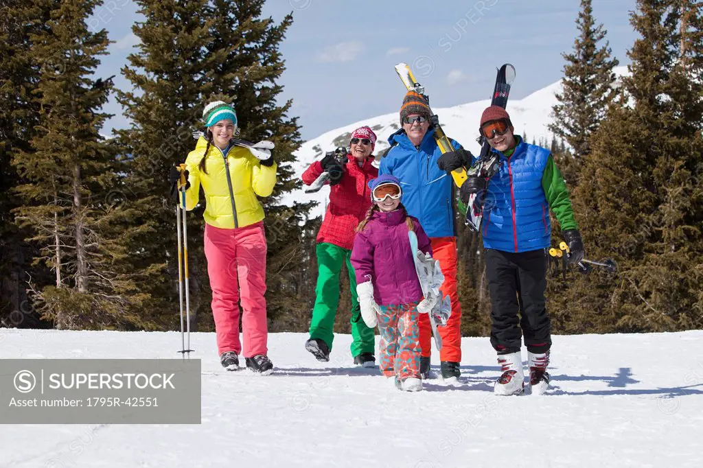 USA, Colorado, Telluride, Three_generation family with girl 10_11 posing during ski holiday
