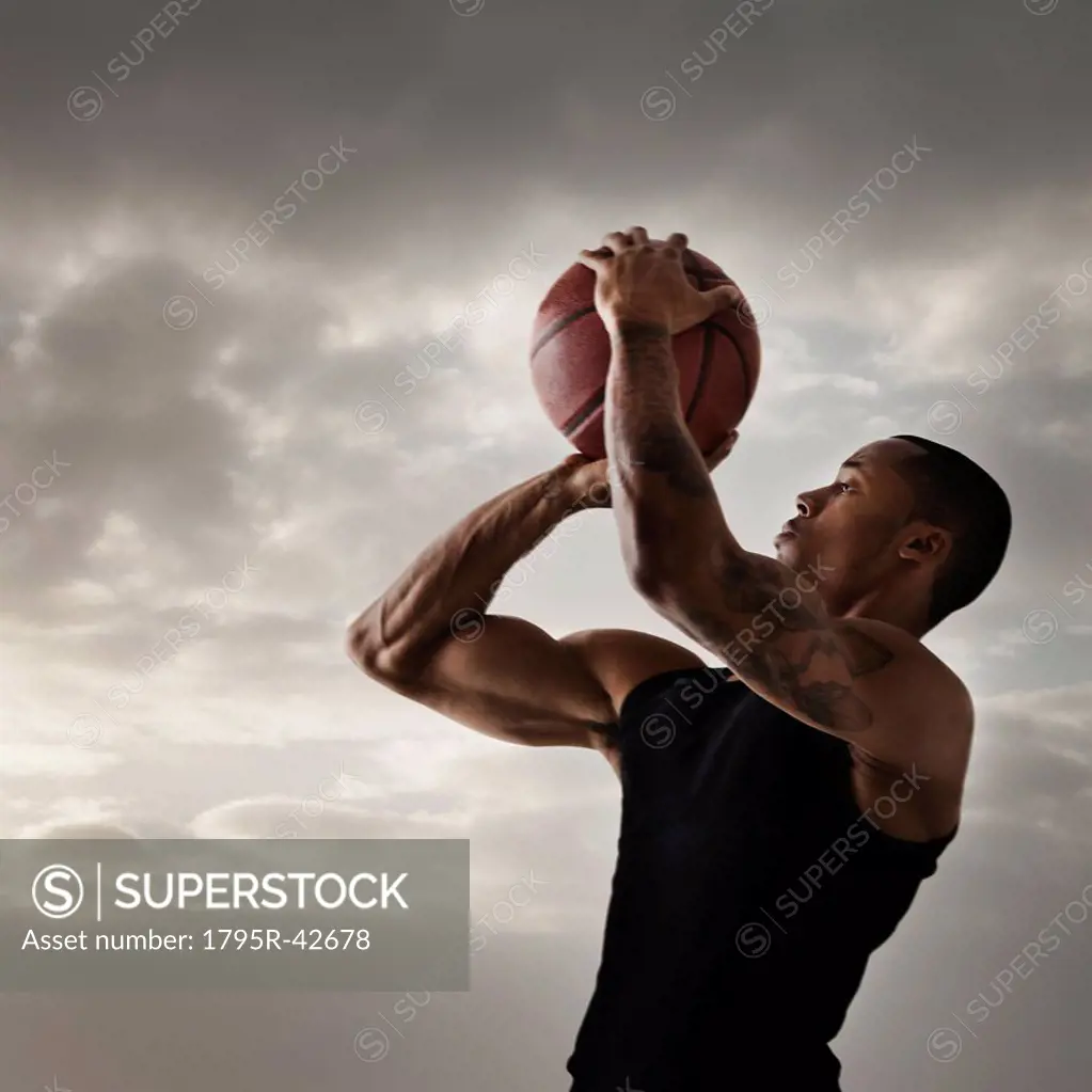 USA, Utah, Salt Lake City, Young man playing basketball