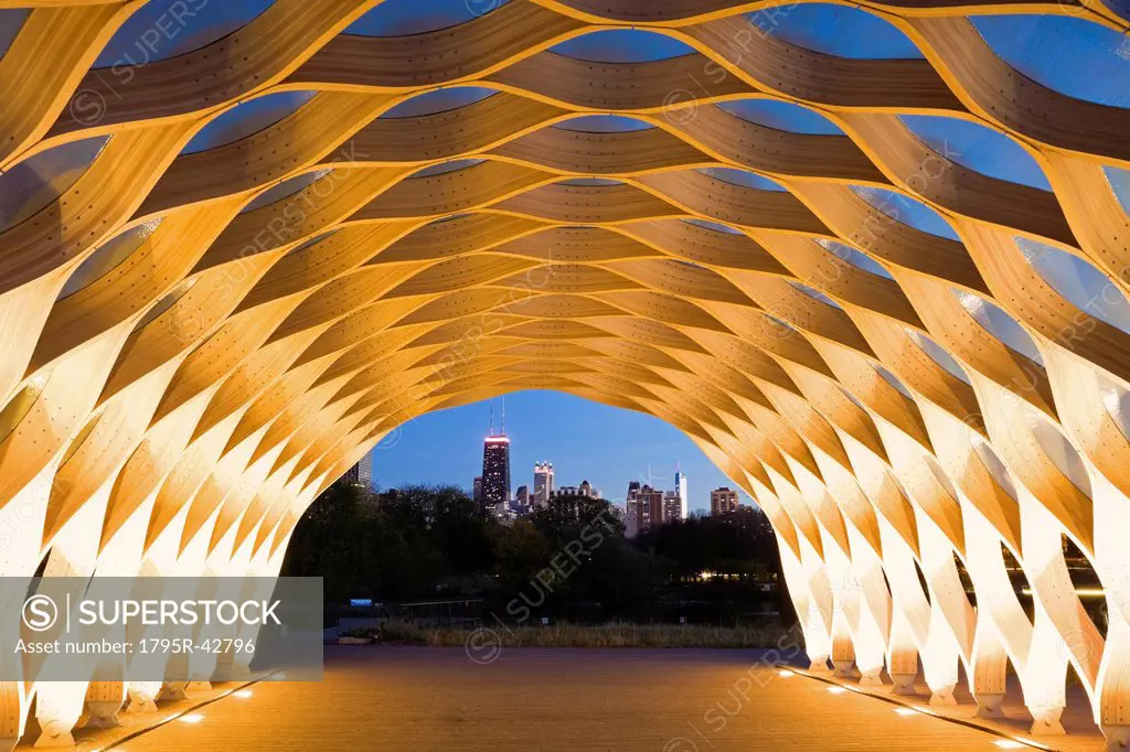 USA, Illinois, Chicago, Illuminated tunnel with city skyline in distance, dusk