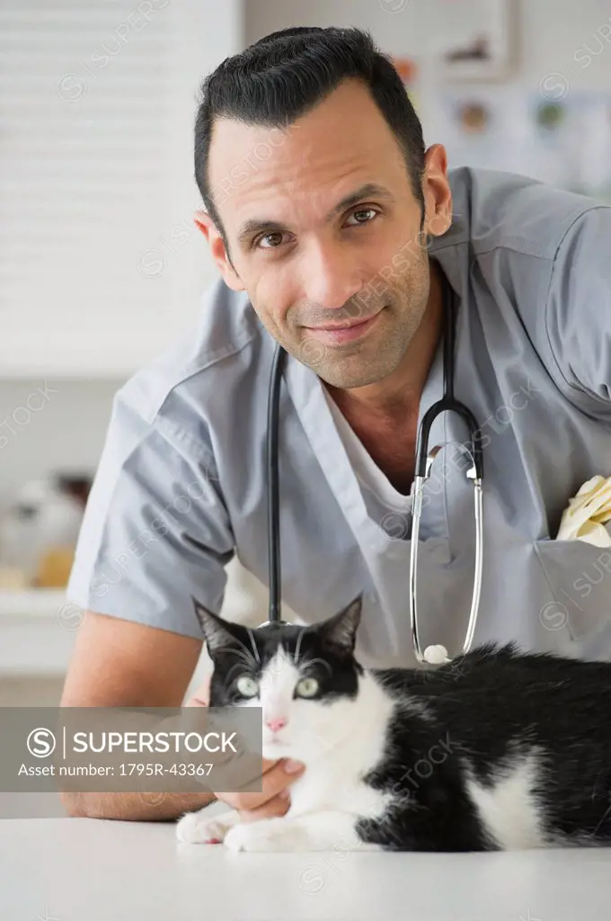 Vet stroking cat in pet clinic