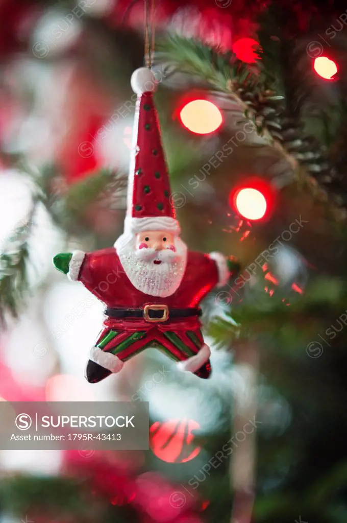 Santa Claus Christmas decoration hanging on Christmas tree, studio shot