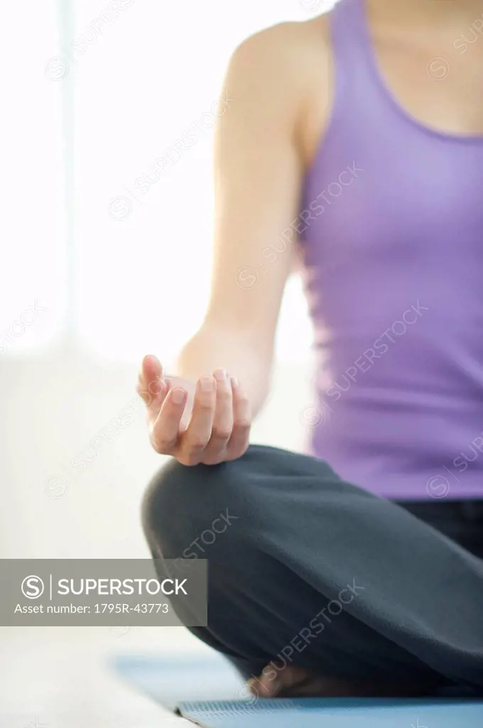 Young woman meditation in lotus position