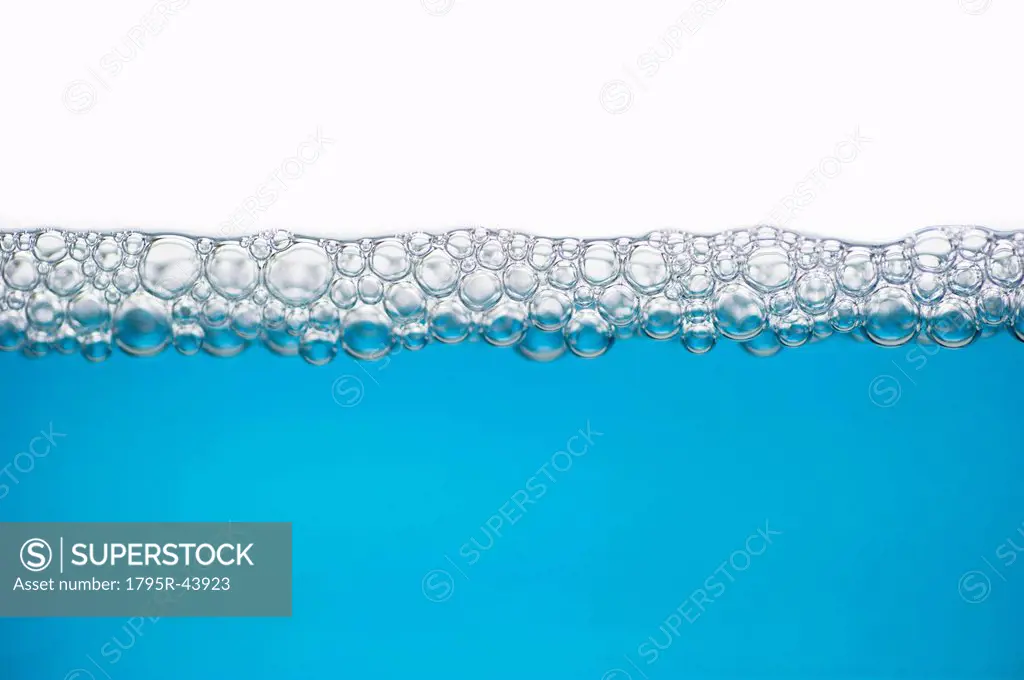 Close up of soap bubbles on water surface