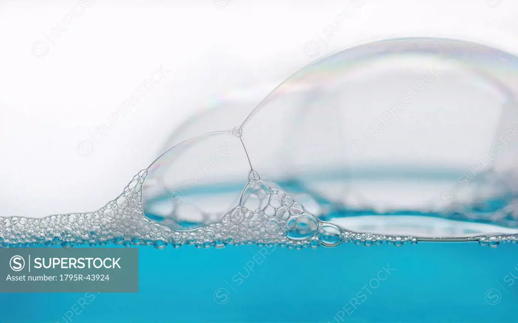 Close up of soap bubbles on water surface