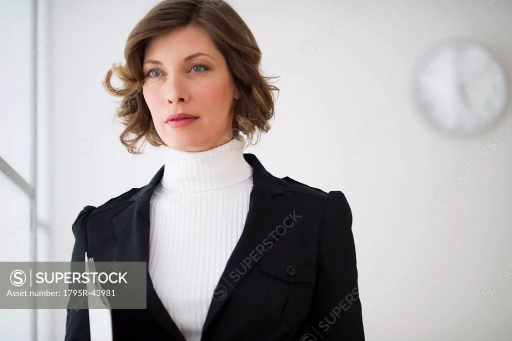 USA, New Jersey, Jersey City, portrait of businesswoman in office