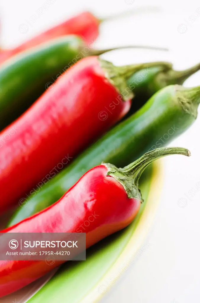 Studio shot of red and green Chili Peppers