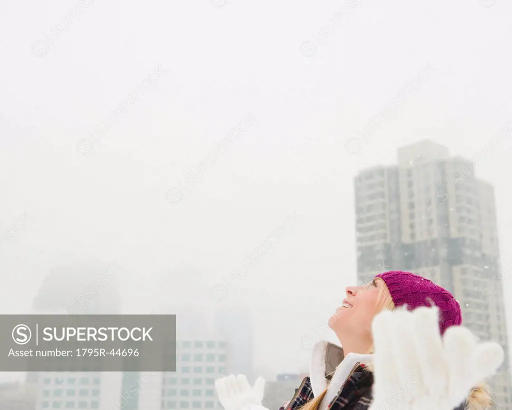 Jersey City, New Jersey, woman looking at bright sky