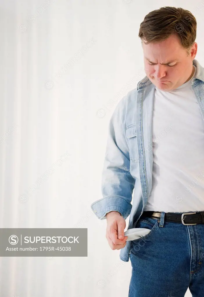 USA, Jersey City, New Jersey, man emptying pockets