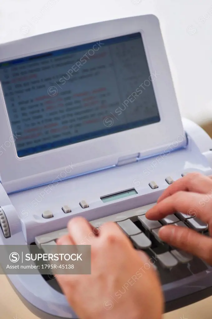 USA, Jersey City, New Jersey, court stenographer using stenograph machine