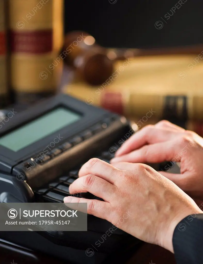 USA, Jersey City, New Jersey, court stenographer using stenograph machine