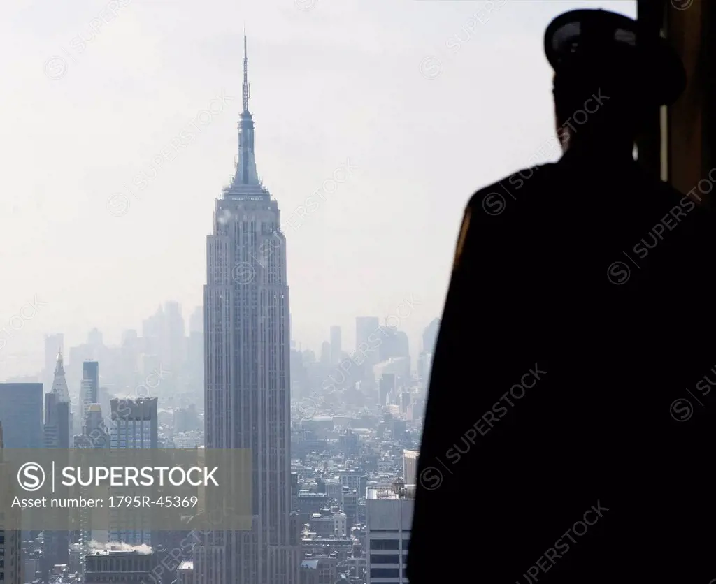 USA, New York City, Manhattan, Steward watching Empire State Building