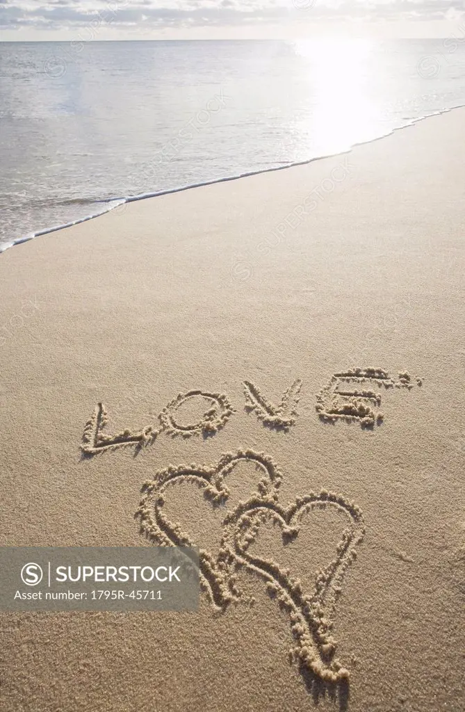 USA, Massachusetts, love sign with heart shapes on sand