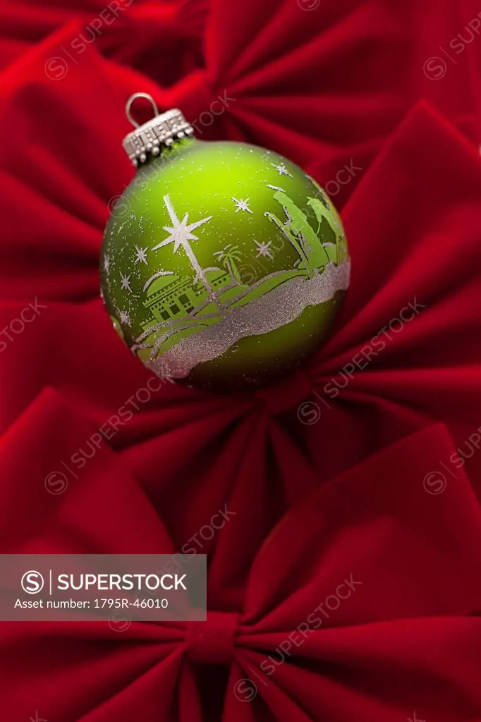 Studio Shot of red velvet bows with green Christmas ornament