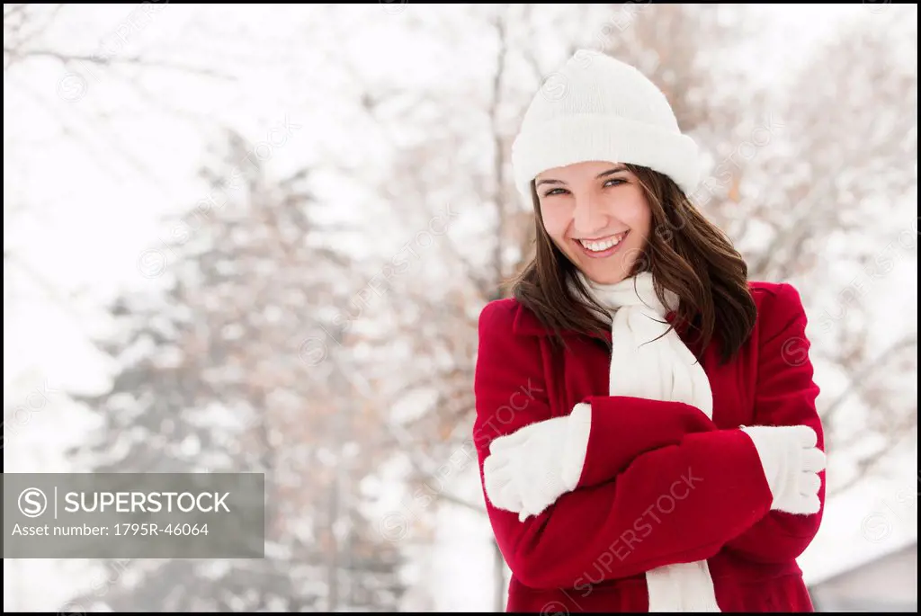 USA, Utah, Lehi, Portrait of young woman shivering in snow