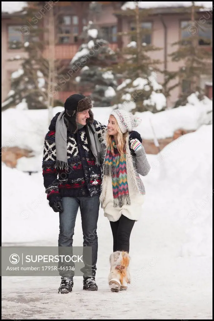 USA, Utah, Salt Lake City, couple walking in snowy village