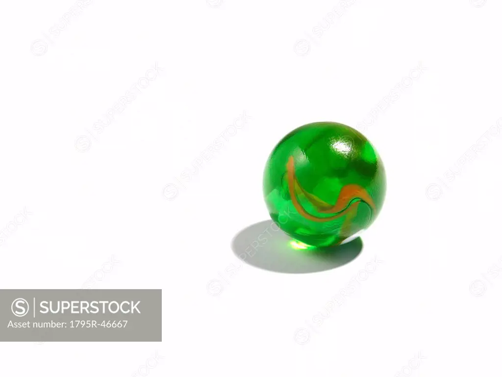 Studio shot of small green glass ball