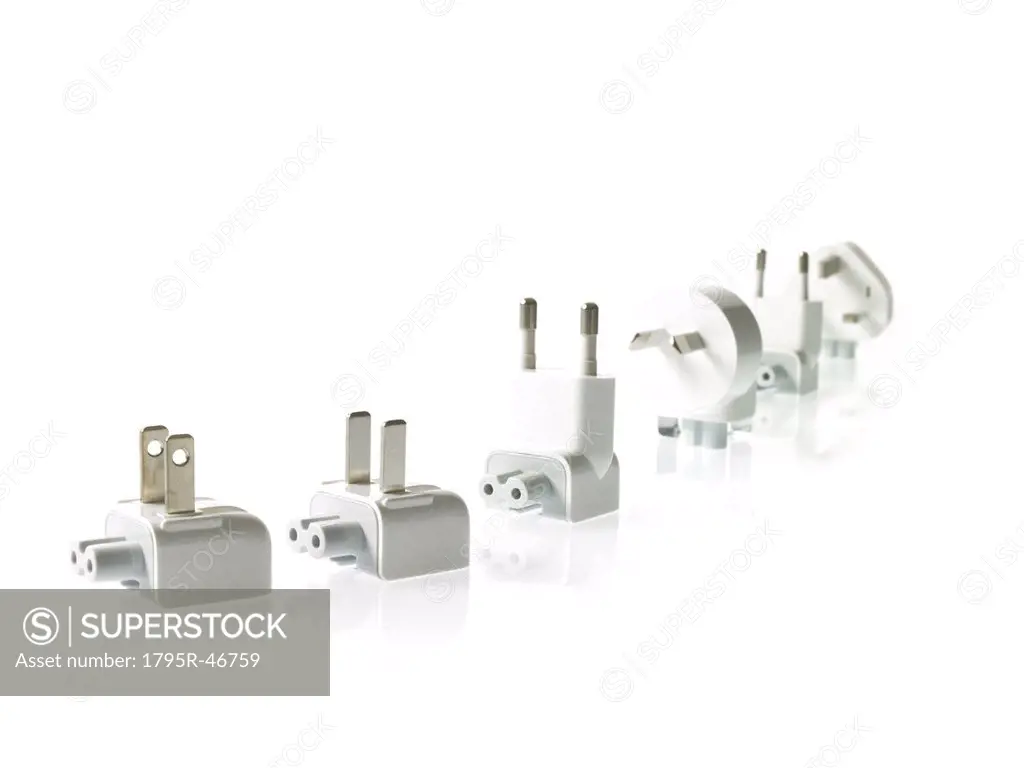 Row of plugs on white background