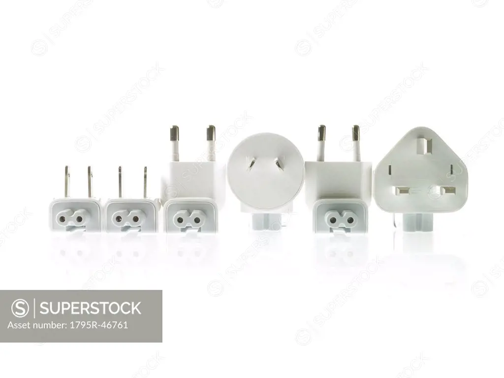 Row of plugs on white background