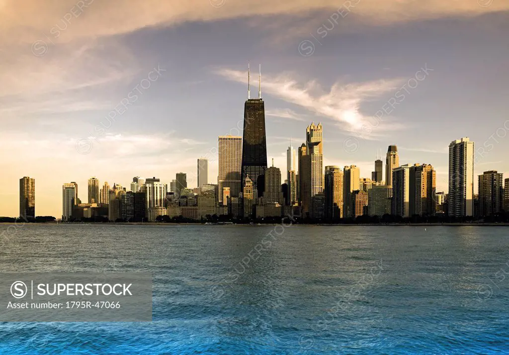 USA, Illinois, Chicago, City skyline over Lake Michigan at sunset