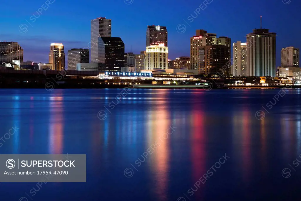 USA, Louisiana, New Orleans, Mississippi River and skyline illuminated at night