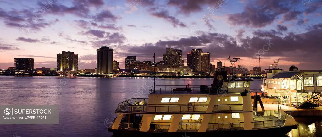 USA, Louisiana, New Orleans, Ferry on Mississippi River with city skyline