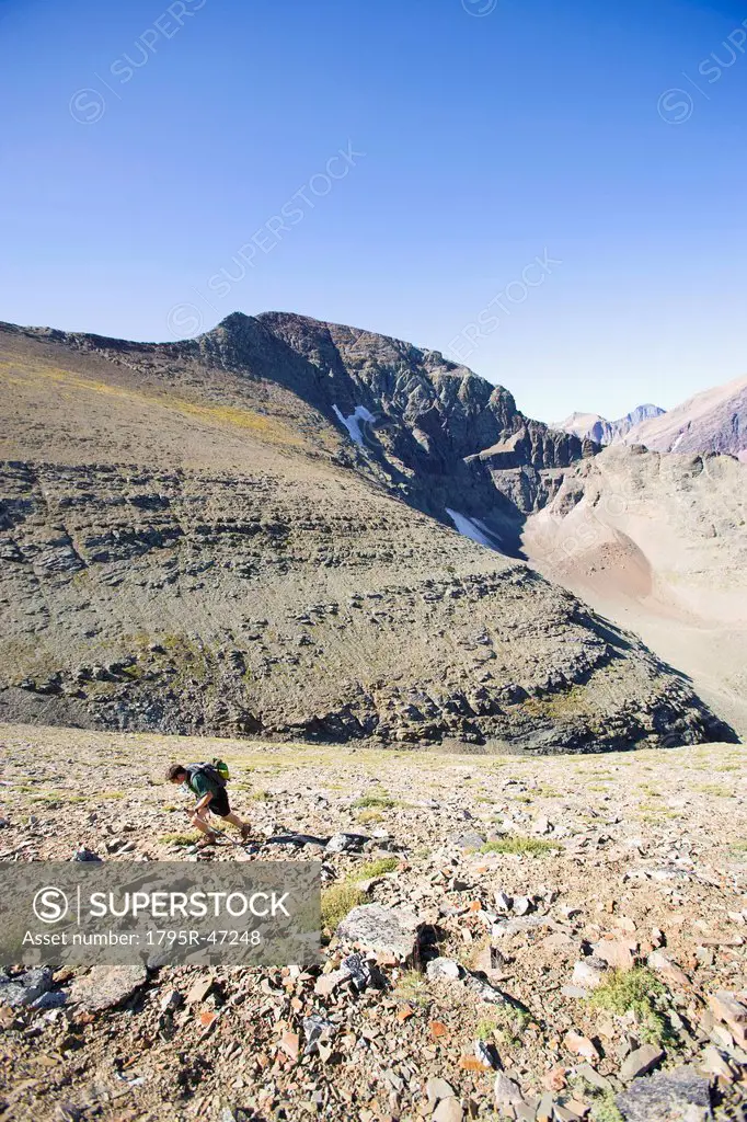 USA, Montana, Glacier National Park, Mid adult man hiking