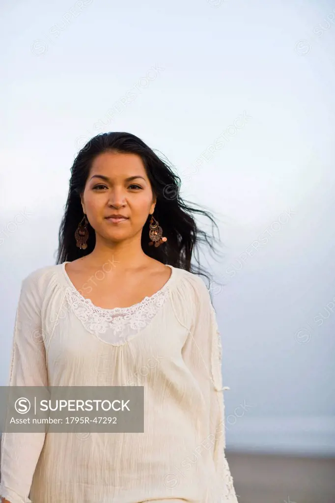 USA, California, Stinson Beach, Portrait of young woman on beach