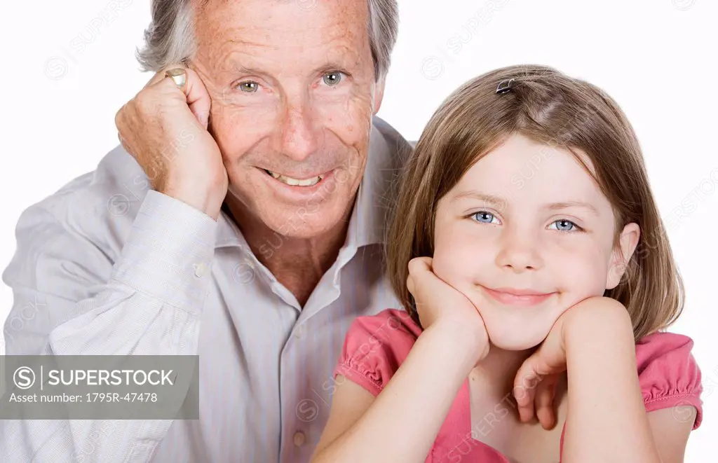 Studio portrait of senior man with granddaughter 6_7
