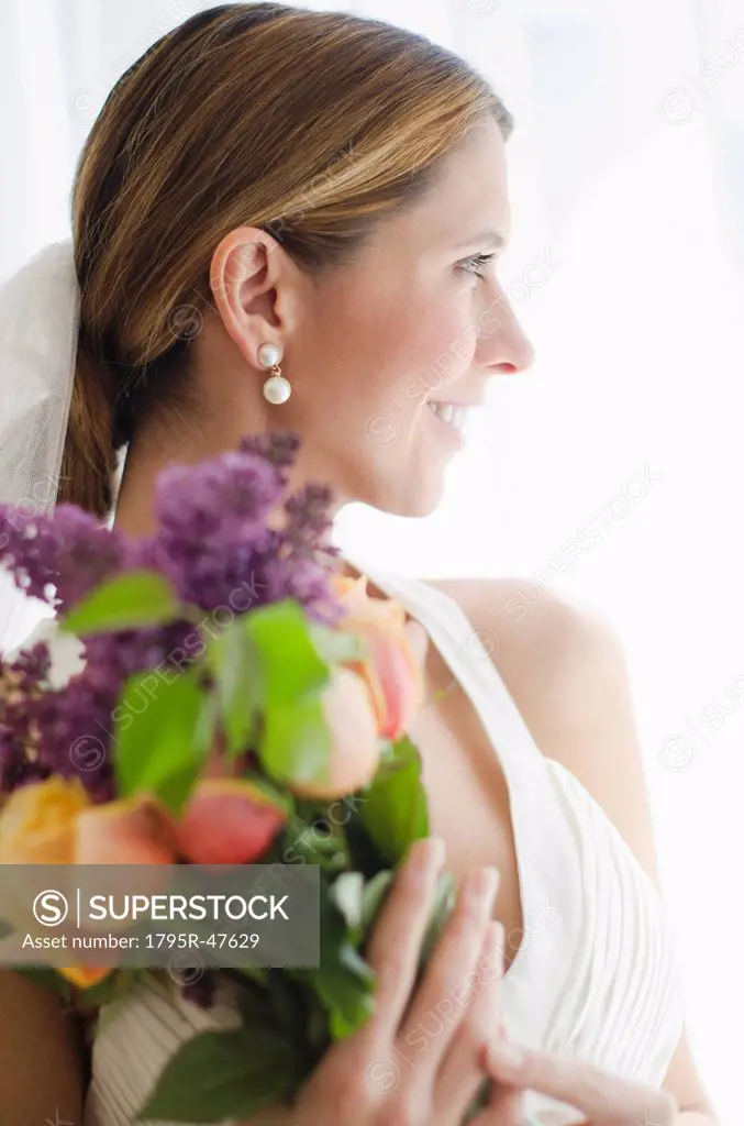 Bride holding floral bouquet