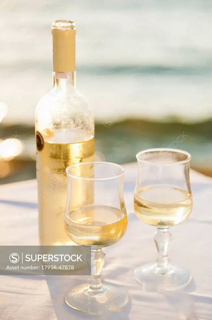 Greece, Cyclades Islands, Mykonos, Wine on table by sea