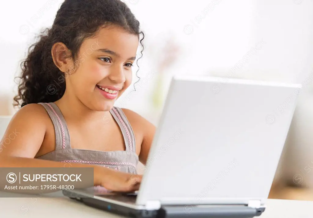 Girl 8_9 using laptop