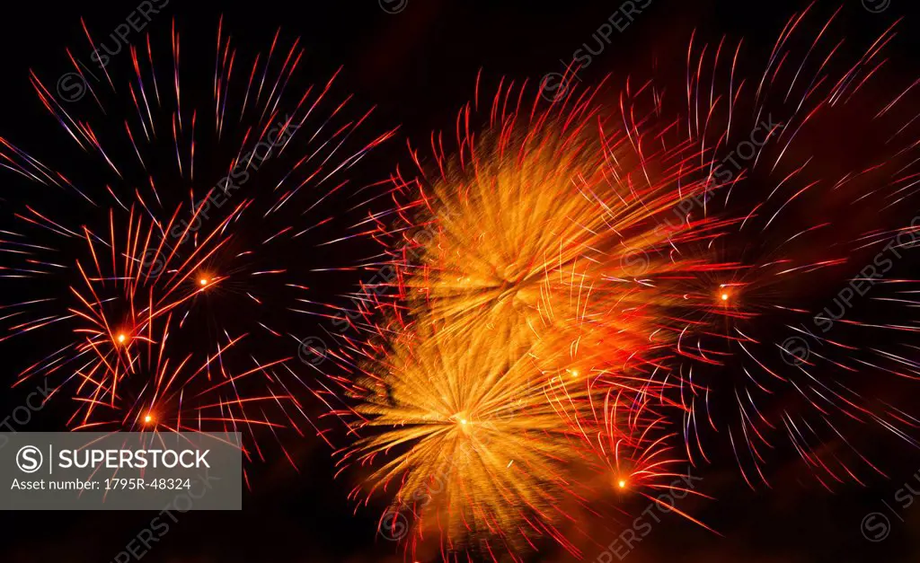 Fireworks explosion against night sky