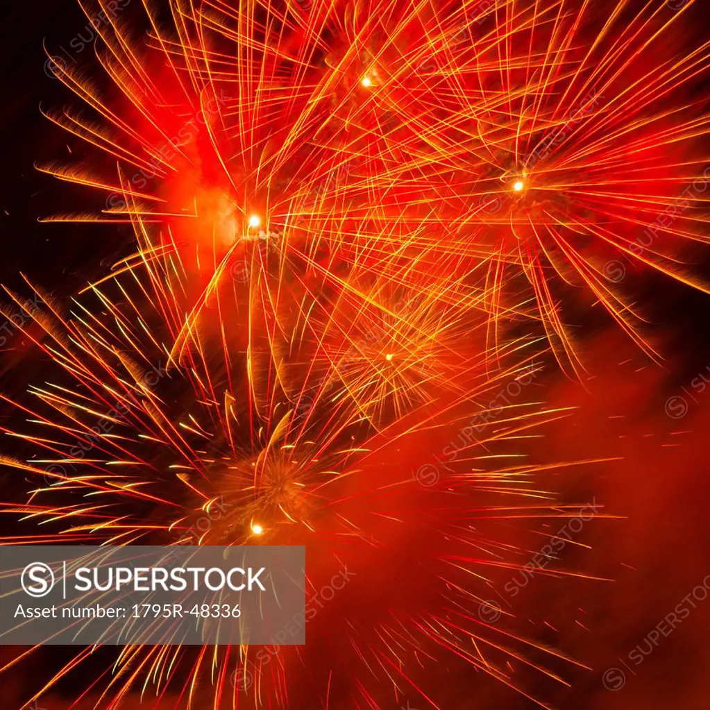 Fireworks explosion against night sky