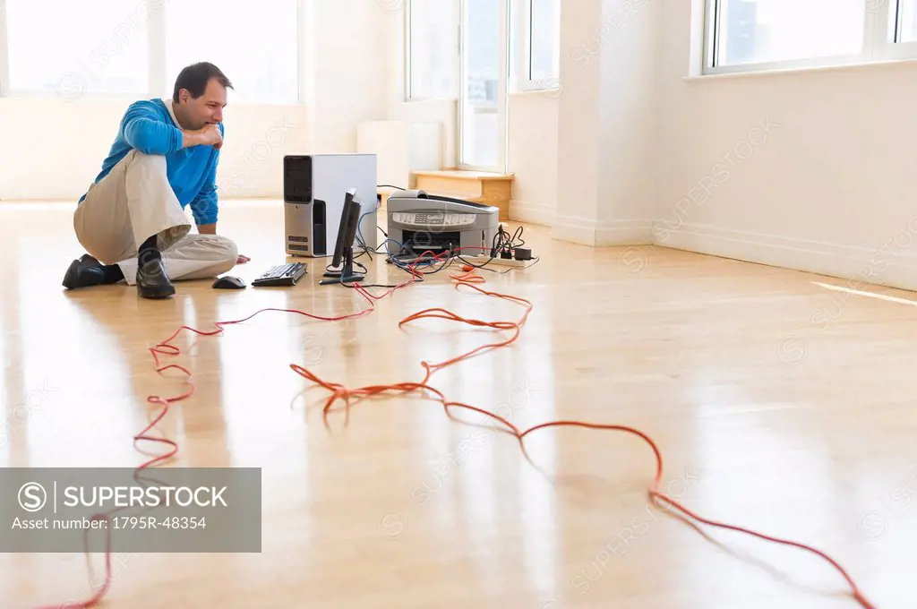 Businessman setting up internet in new office