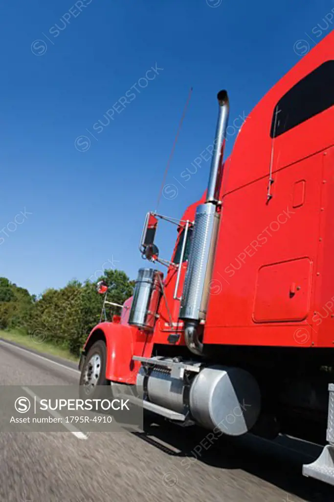 Large red truck on the highway