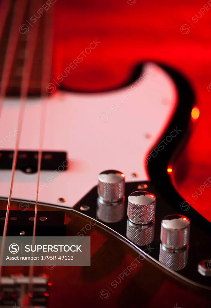 Close up of volume knobs of bass guitar