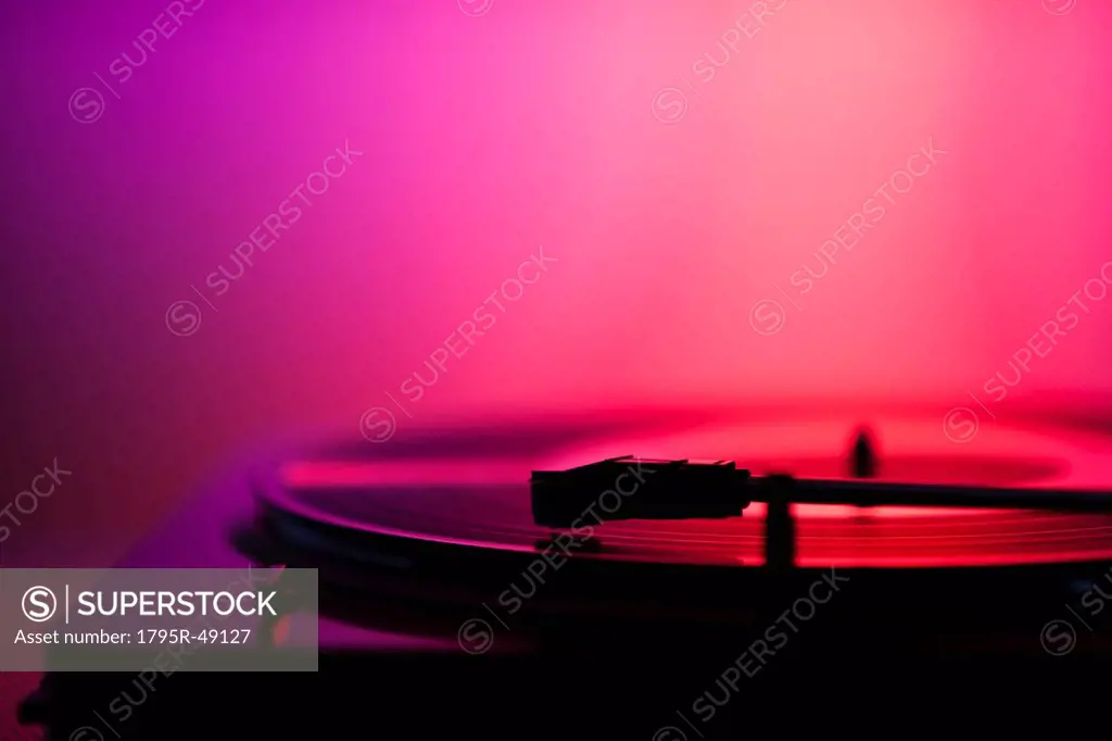 Close up of turntable on pink background