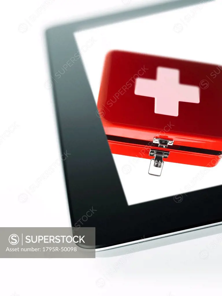 Studio shot of first aid kit on digital tablet