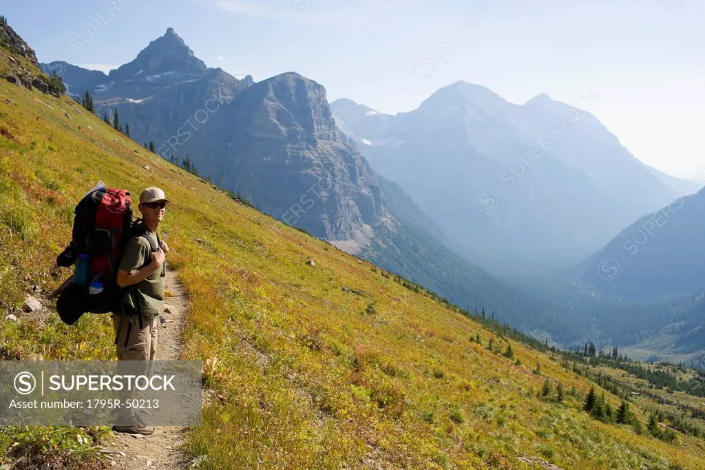 USA, Montana, Glacier National Park, Browns Pass, Mid adult hiker posing