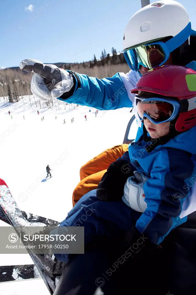 USA, Colorado, Telluride, Father with son 2_3 on ski lift