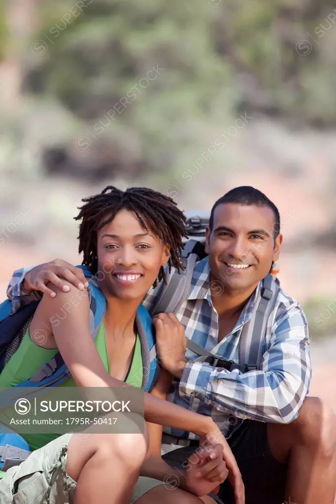 Young couple hiking and enjoying desert scenery